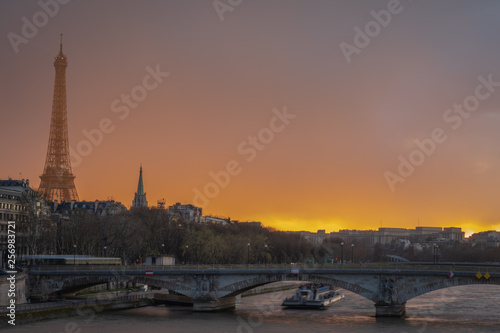 Paris, France - 03 17 2019: Quays of the Seine. View of Eiffel Tower from Alexander III Bridge