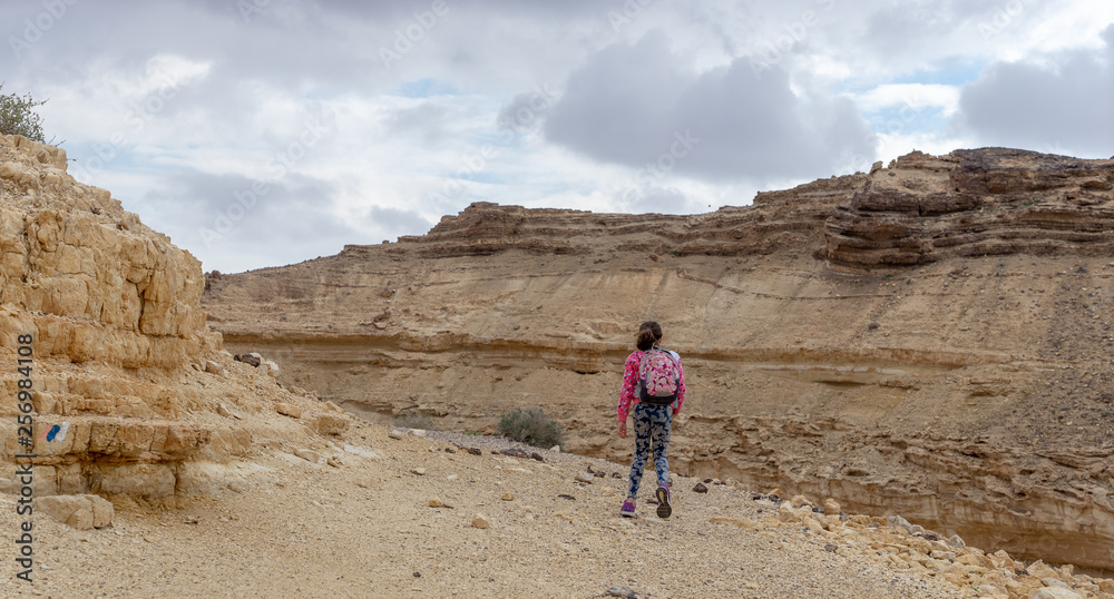 Child in hiking trek of Israeli desert