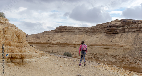 Child in hiking trek of Israeli desert