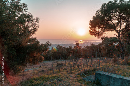 Thessaloniki / Greece 22 march 2019 : sunset in the most beautiful city of Greece photo taken from the hilltop forest Kedrinos Lofos, also known as Seich Sou,the temperture is fine for a walk