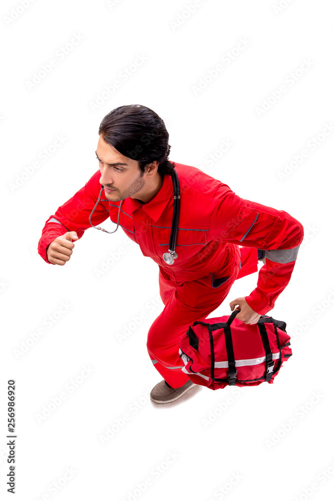 Young paramedic in red uniform isolated on white Young paramedic in red uniform isolated on white