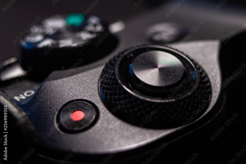 Part of black digital mirrorless camera. Macro close-up shot.