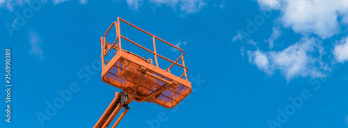 Canvastavla Cherry picker on blue sky background