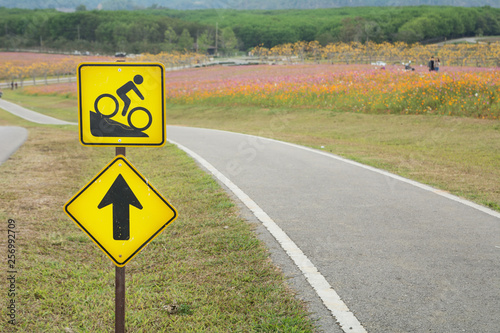 Warning bicycle road signs downhill with bicycle lane on the hill with copy space , Road sign for bike, Downhill bike sign
