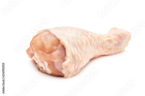 Raw chicken leg on white background.