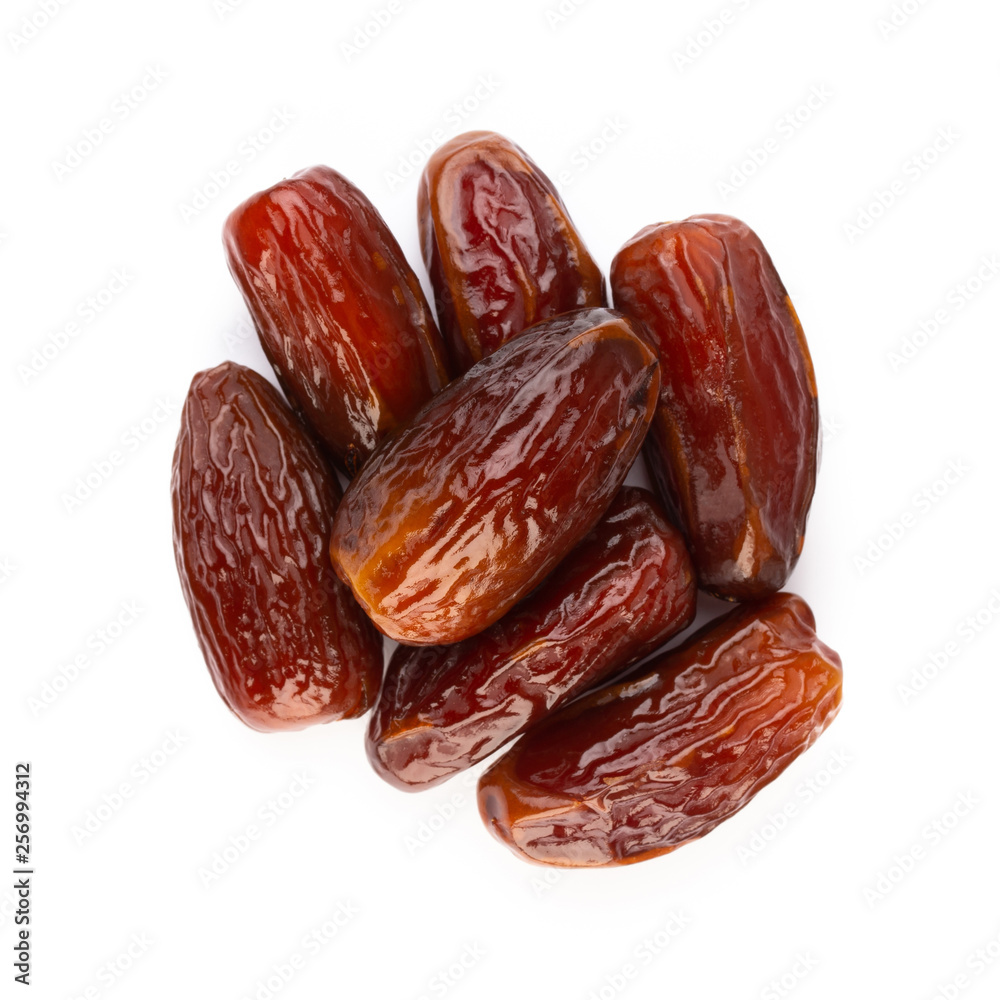 Dry dates isolated on white background. Top view. Flat lay pattern. Dry dates isolated on white background. Top view. Flat lay pattern.