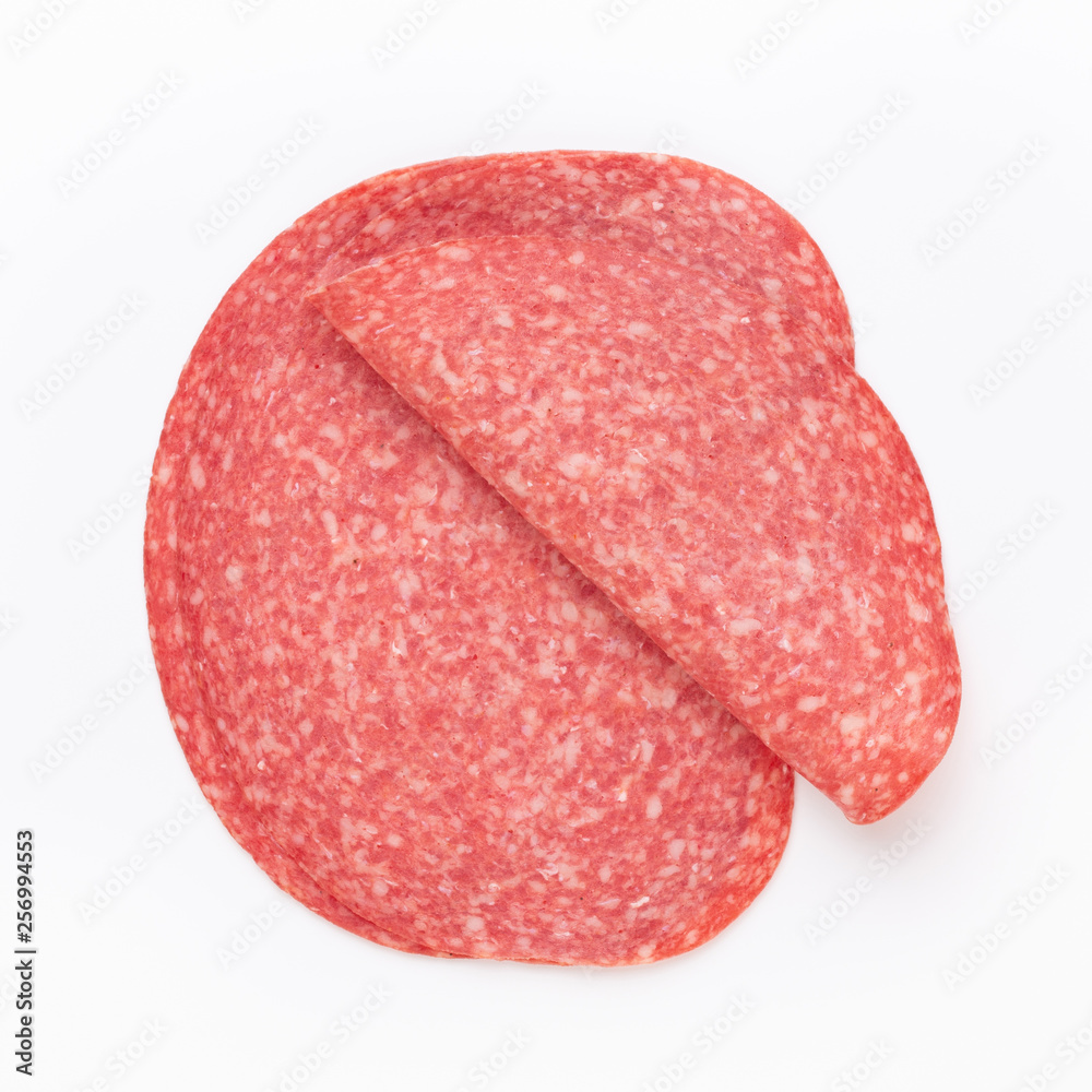 Salami slices on white background. Salami slices on white background.
