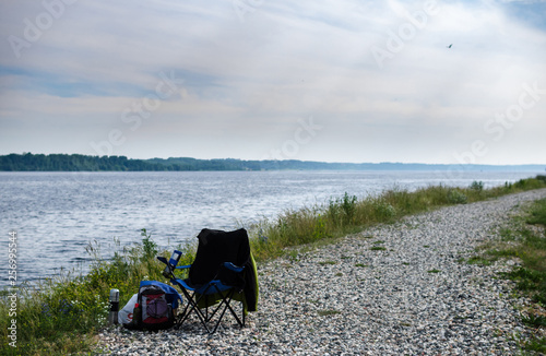 rocky beach by the river, reeds on the lake