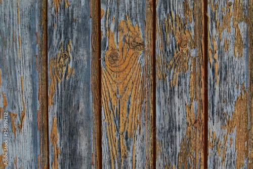 old weathered boards vertical shabby cracked paint yellow close-up texture old wood background grunge