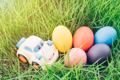 Easter egg and Car on grass background,