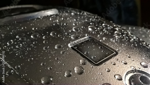 water drops on the metal surface of the fuel tank