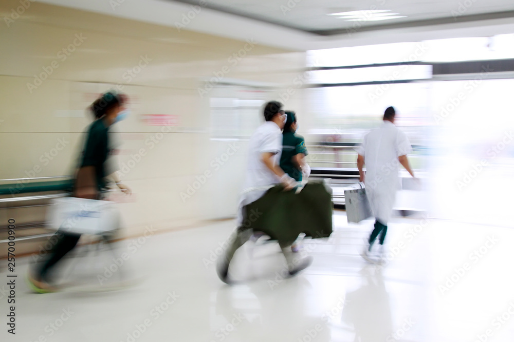 Health care workers rushed past emergency treatment hall