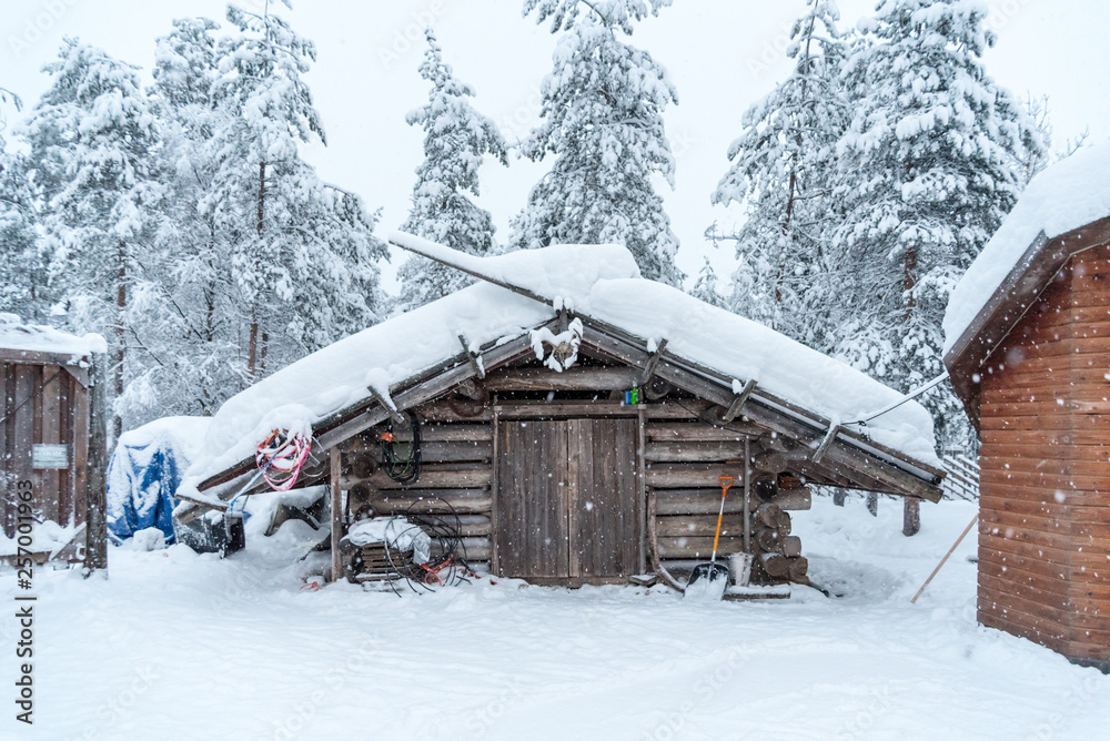 Wooden hut covered in snow near Rovaniemi in Lapland, Finland Wooden hut covered in snow near Rovaniemi in Lapland, Finland