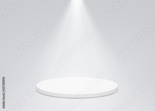 Photo Round podium pedestal with bright lighting, a searchlight