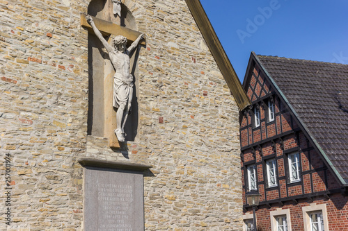 Statue of Jesus at the facade of the Petrikapelle in Freckenhorst, Germany photo