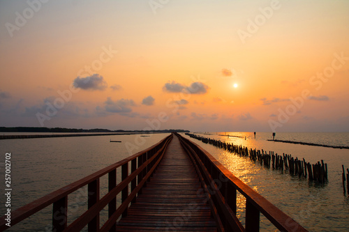 Fototapeta Naklejka Na Ścianę i Meble -  Long Bridge at sea view on morning seascape sunrise background