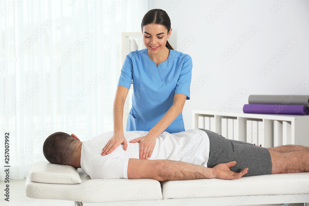 Doctor working with patient in hospital. Rehabilitation massage Doctor working with patient in hospital. Rehabilitation massage