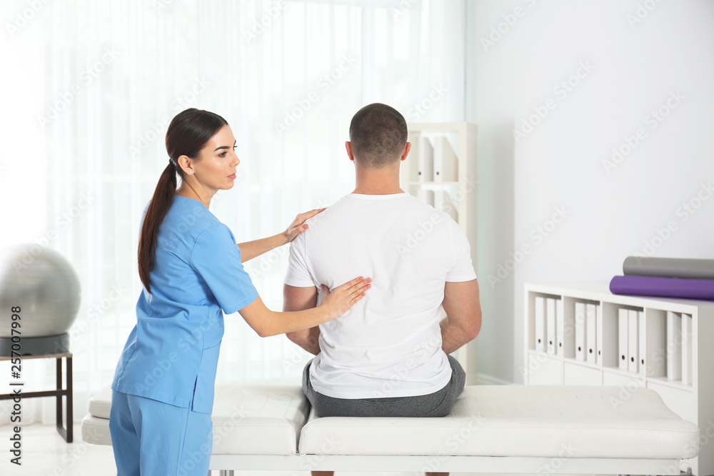 Doctor working with patient in hospital. Rehabilitation massage Doctor working with patient in hospital. Rehabilitation massage