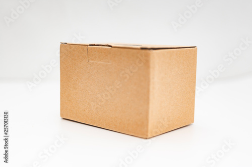 close-up view of a cardboard box over white background