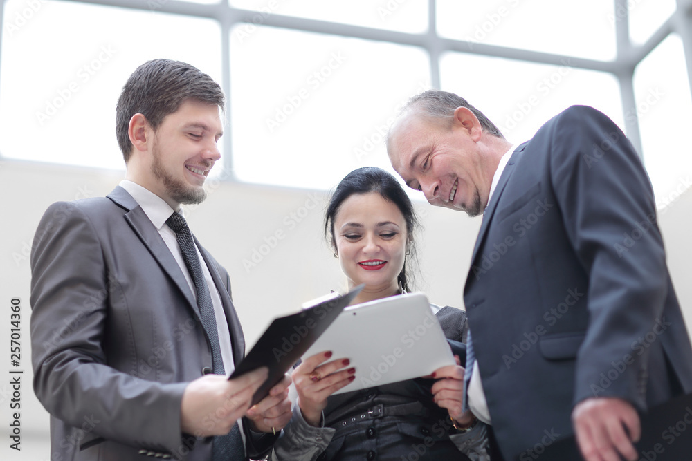 close up. friendly colleagues talking in the office. close up. friendly colleagues talking in the office.
