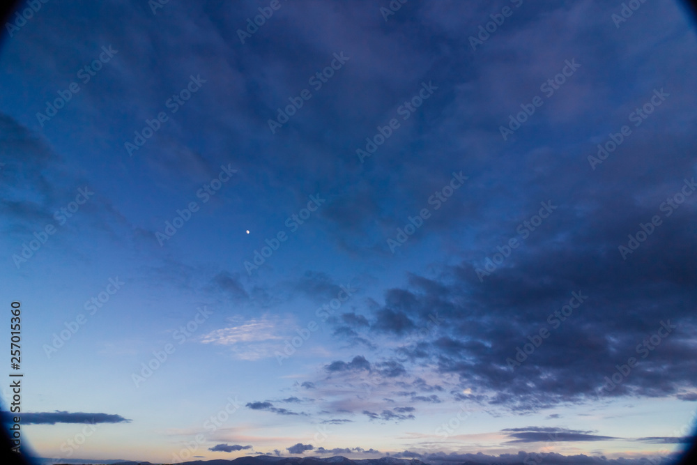 Beautiful vista of the twilight sky above the Snowdonia Mountain Range from Pentraeth, Isle of Anglesey, North Wales,