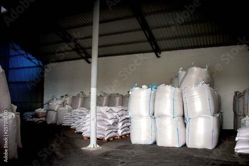 Abstract agrarian image with bags of grain in the agricultural sector in the farm. (good harvest, abundance - concept)