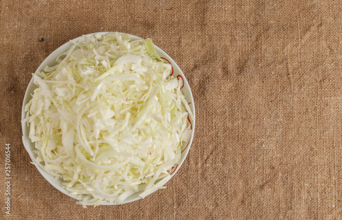 Fresh chopped cabbage on a plate.