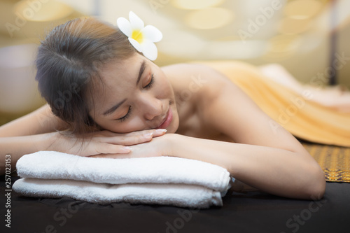 Beautiful young woman in spa salon  Body care. Spa body massage woman hands treatment. Woman having massage in the spa salon