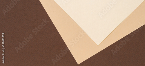 Color papers geometry composition banner background with beige and brown color tones