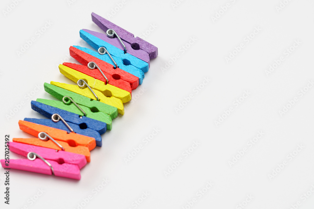 Colorful wooden clothespins on white background Colorful wooden clothespins on white background