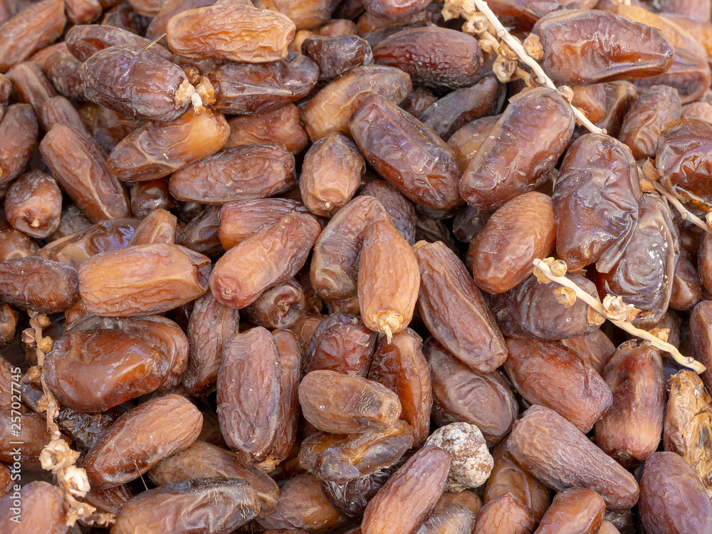 Dried dates on outdoor market stall. Dried dates on outdoor market stall.
