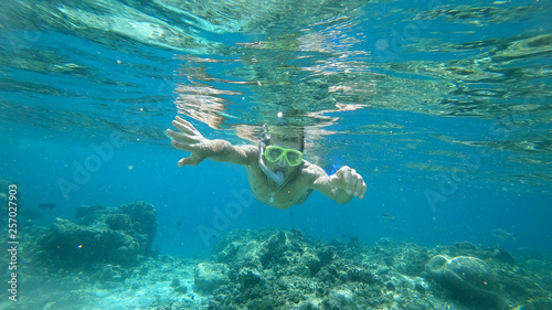 snorkeling the man under water with a mask the Indian Ocean