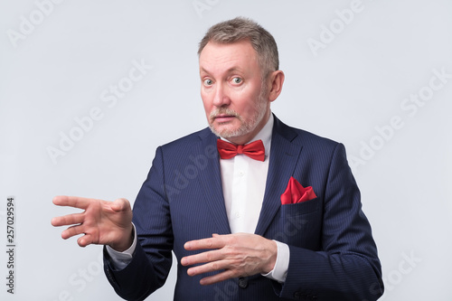 man in blue suit duscussing question with you photo