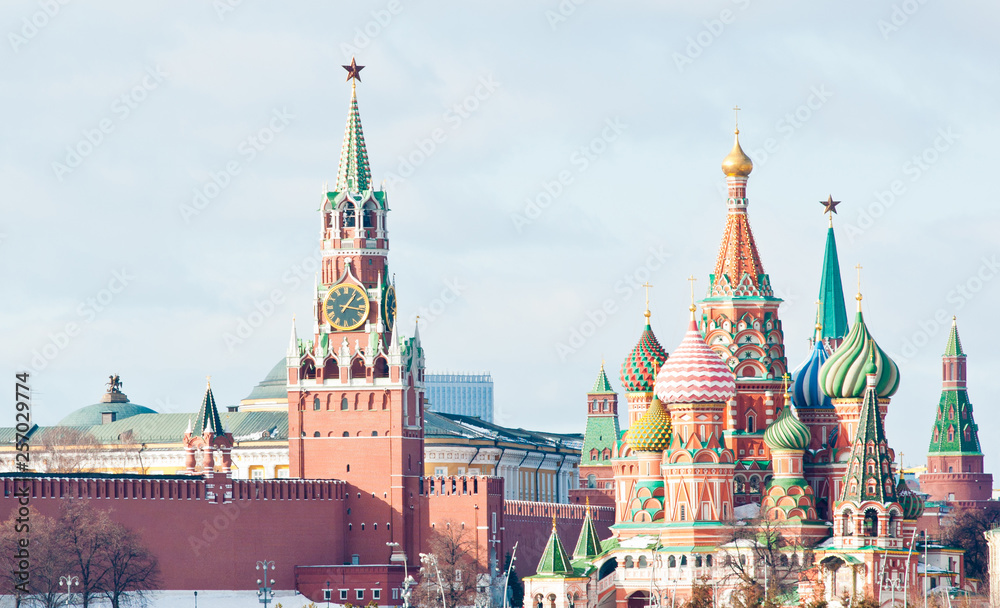 Spasskaya Tower of Moscow Kremlin and the Cathedral of Vasily the Blessed (Saint Basil's Cathedral) on Red Square. Sunny winter day. Moscow. Russia