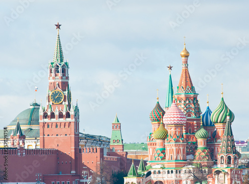 Spasskaya Tower of Moscow Kremlin and the Cathedral of Vasily the Blessed (Saint Basil's Cathedral) on Red Square. Sunny winter day. Moscow. Russia