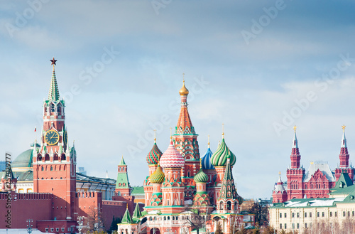 Spasskaya Tower of Moscow Kremlin  Cathedral of Vasily the Blessed  Saint Basil s Cathedral  and the State Historical Museum on Red Square. Winter sunny day. Moscow. Russia