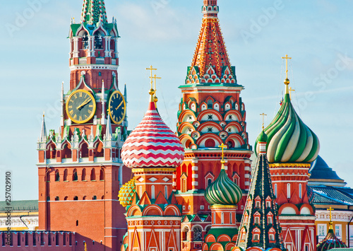 Spasskaya Tower of Moscow Kremlin and the Cathedral of Vasily the Blessed (Saint Basil's Cathedral) on Red Square. Sunny winter day. Moscow. Russia