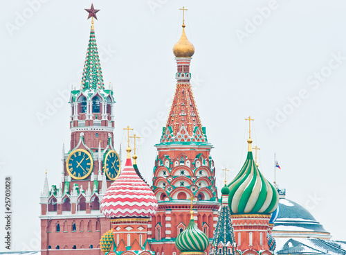 Spasskaya Tower of Moscow Kremlin and the Cathedral of Vasily the Blessed (Saint Basil's Cathedral) on Red Square. Winter day. Moscow. Russia