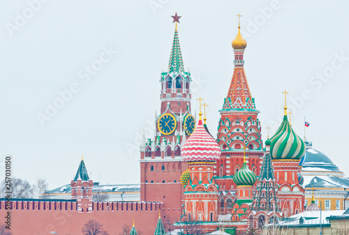 Spasskaya Tower of Moscow Kremlin and the Cathedral of Vasily the Blessed (Saint Basil's Cathedral) on Red Square. Winter day. Moscow. Russia