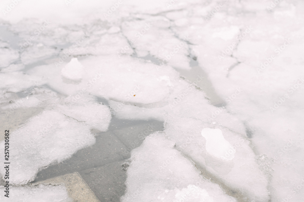 melting ice in the city. broken ice outside