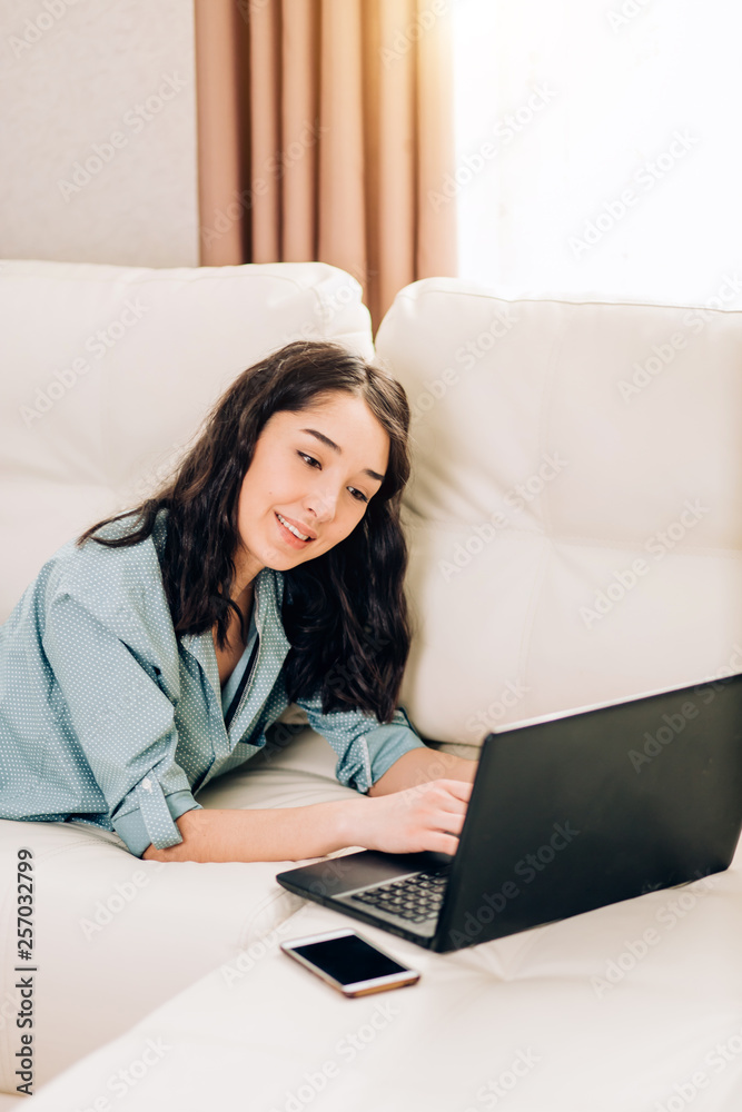 Bbeautiful woman using laptop computer at home on sofa Bbeautiful woman using laptop computer at home on sofa