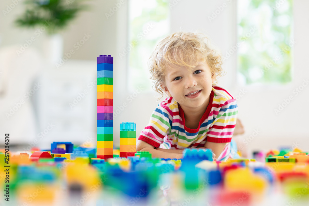 Child playing with toy blocks. Toys for kids. Child playing with toy blocks. Toys for kids.