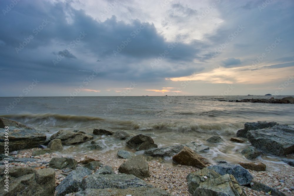 Peaceful beach view and waves during sunset at Jeram, Kuala Selangor Malaysia