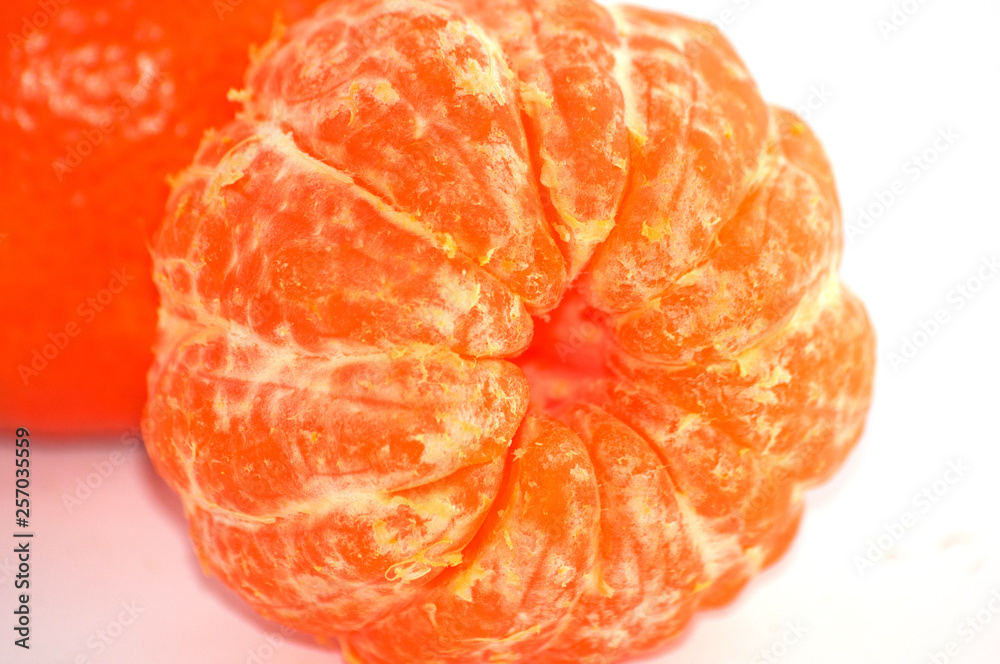 Tangerine macro, juicy ripe sweet tangerine slices close-up Tangerine macro, juicy ripe sweet tangerine slices close-up