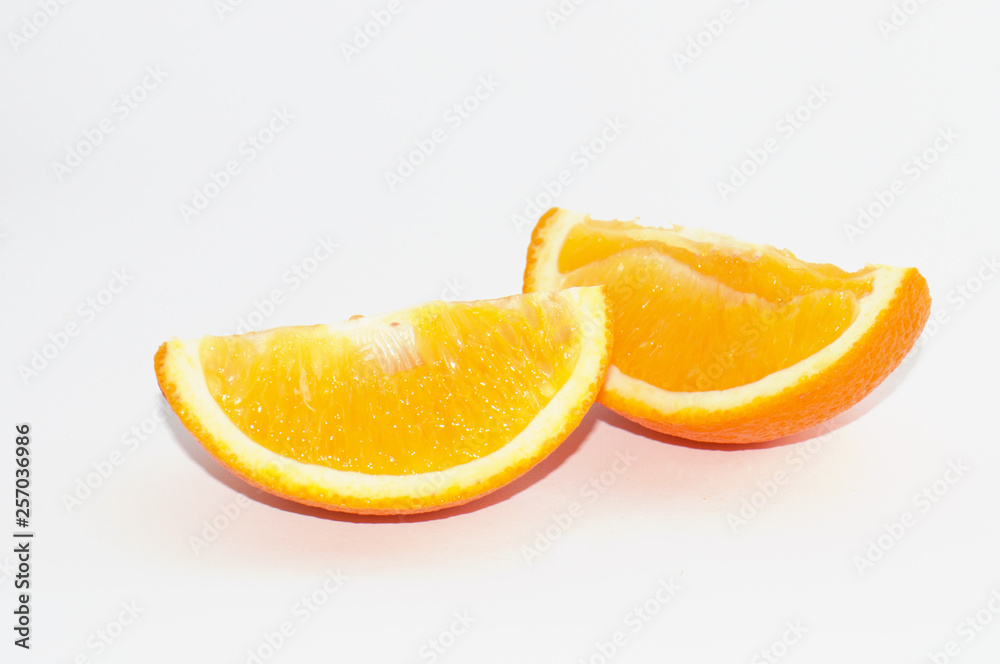 Juicy slices of ripe orange on a white background, isolate Juicy slices of ripe orange on a white background, isolate