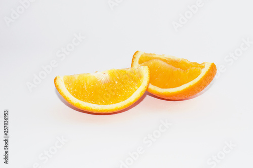 Juicy slices of ripe orange on a white background  isolate