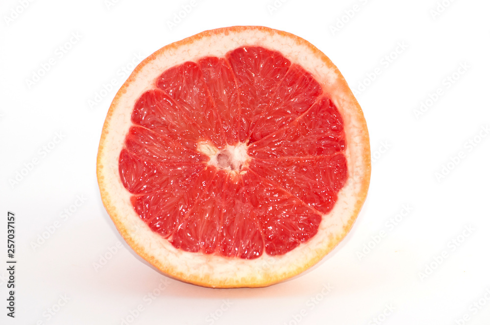 Slices of grapefruit macro closeup on white background Slices of grapefruit macro closeup on white background