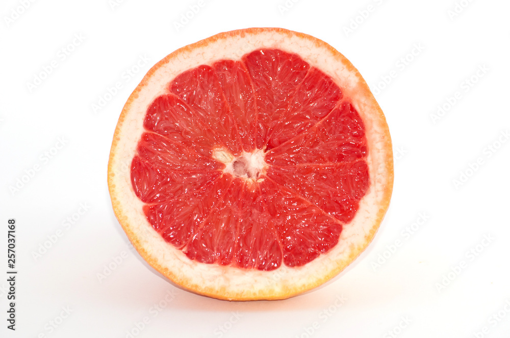 Slices of grapefruit macro closeup on white background Slices of grapefruit macro closeup on white background