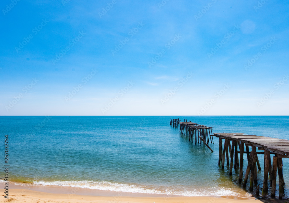 Sea view, blue sky, old wooden bridge, beautiful summer Sea view, blue sky, old wooden bridge, beautiful summer