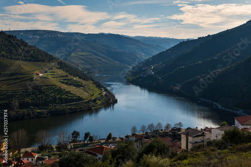 View of the Pinhao village with terraced vineyards and the Douro River, in Portugal  Concept for travel in Portugal and most beautiful places in Portugal © Tiago Fernandez